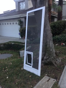 swinging screen door with pet door